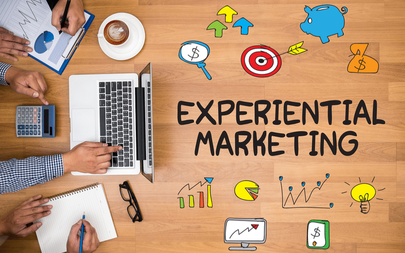 Hands working on experiential marketing strategies